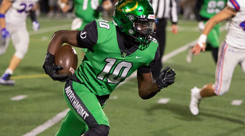 Northmont receiver Rod Moore heads up field Friday night with one of his four receptions from Cade Rice during the Thunderbolts 48-41 playoff victory over Marysville. Jeff Gilbert/CONTRIBUTED