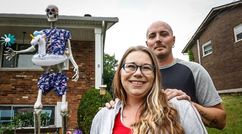 Cyndi White and Jason Thurman are owners of Frank the skeleton on North Heincke Road in Miamisburg. Frank is a Halloween decoration but the couple dress him up for all the holidays and leave him in the yard. JIM NOELKER/STAFF