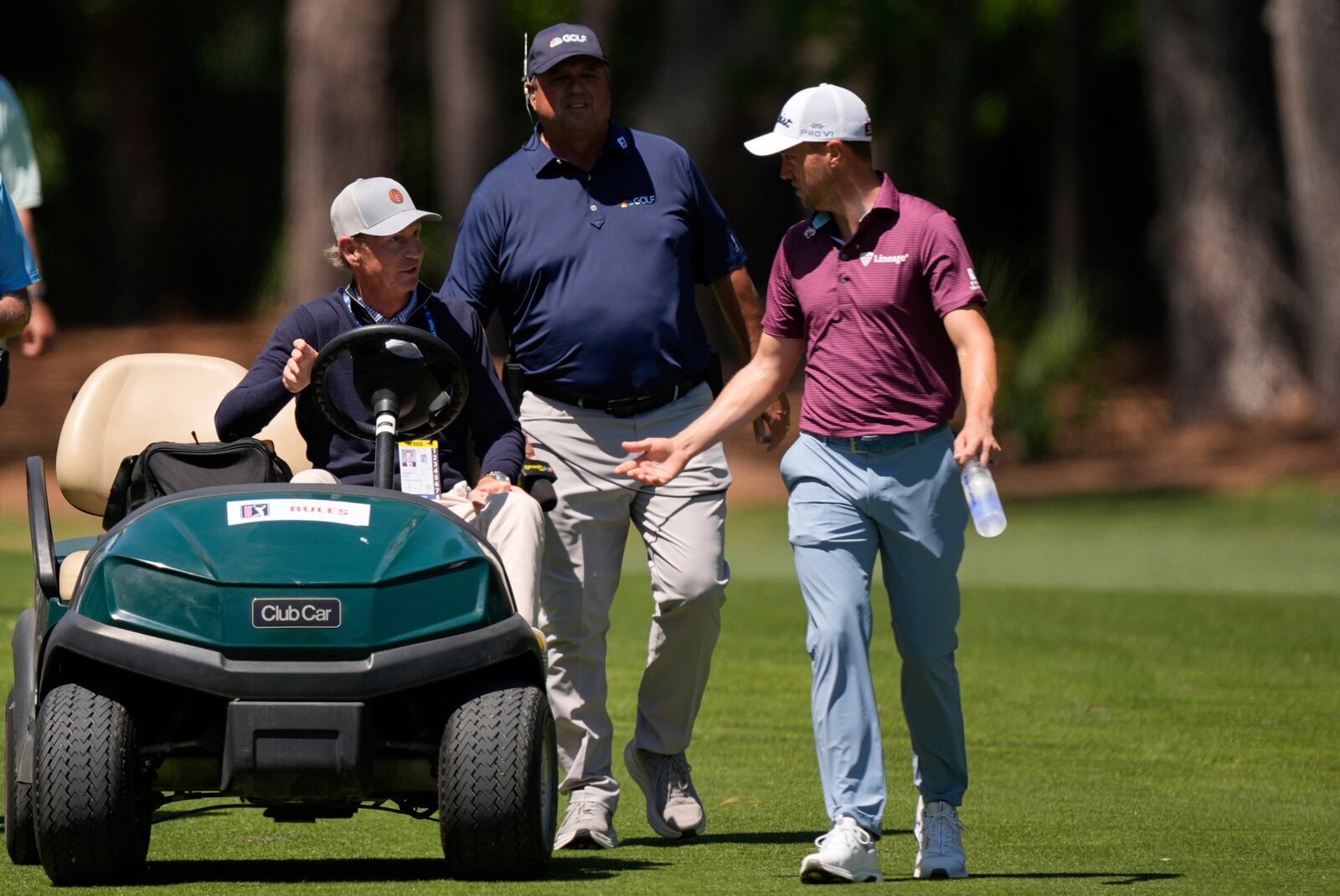 Justin Thomas speaks with an official from the second fairway during the third round of the RBC Heritage golf tournament, Saturday, April 19, 2025, in Hilton Head Island, S.C. (AP Photo/Mike Stewart)