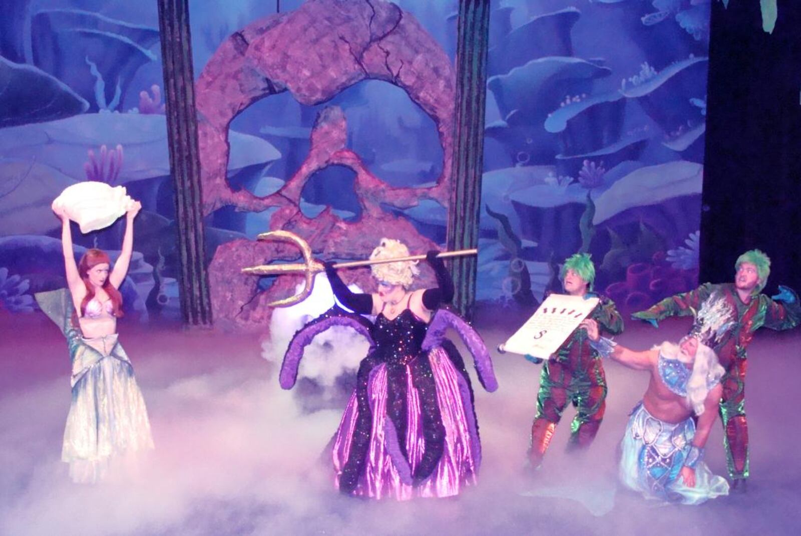 (left to right) KatieAnn Bonavita (Ariel), Tori Kocher (Ursula), Jake Jones (Flotsam), Steven Lakes (King Triton), and Dylan Jackson (Jetsam) in La Comedia Dinner Theatre's production of "The Little Mermaid."