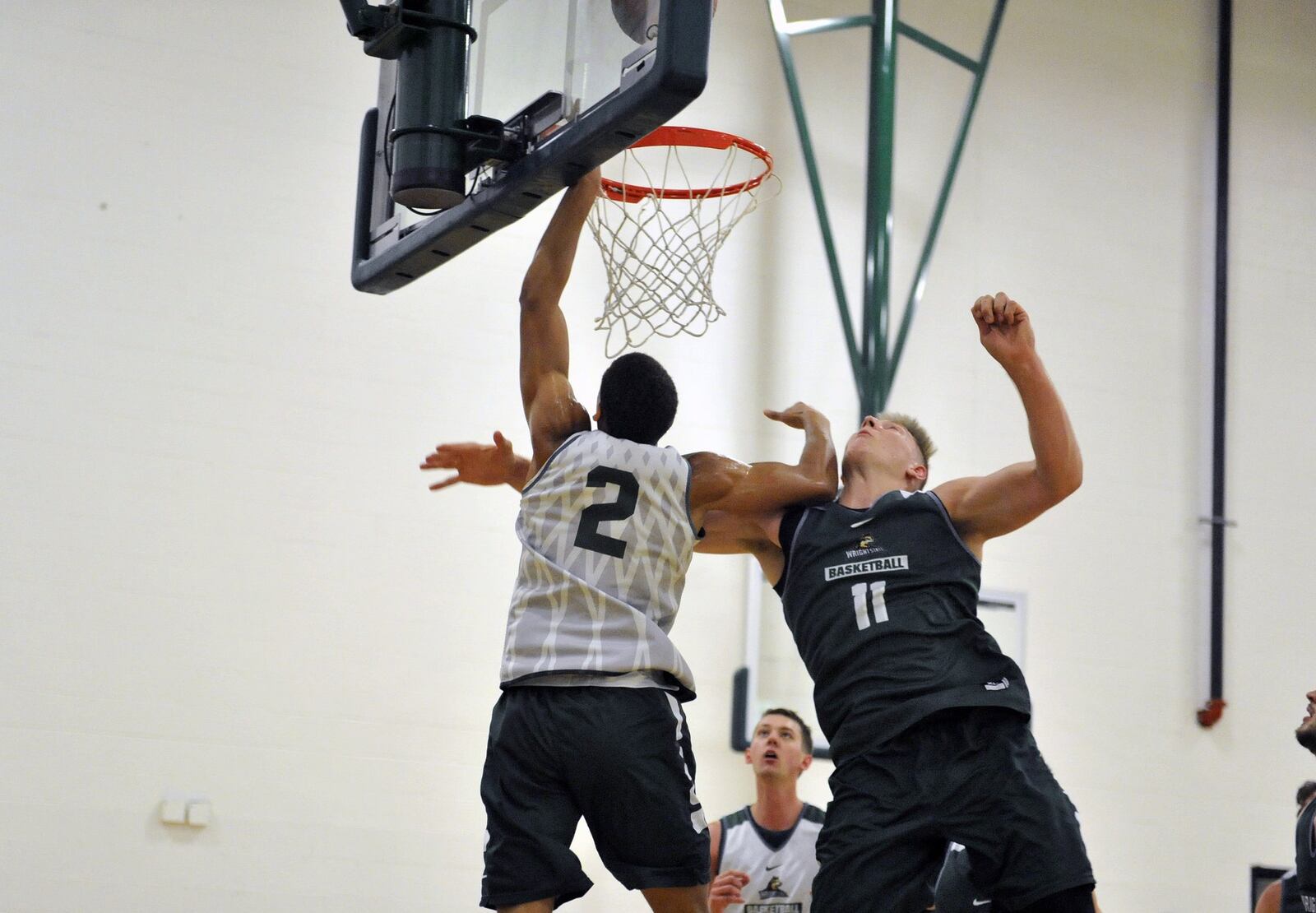 Wright State freshman Everett Winchester (2) puts up a shot against freshman Loudon Love during summer practice Thursday at the Setzer Pavilion.