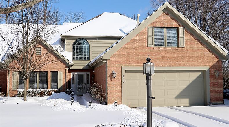 The brick condominium has about 2,880 sq. ft of living space with 3 or 4 bedrooms. Located within the Timberlake community, the property is one of a 2-unit building and has a 2-car, attached garage. CONTRIBUTED PHOTO BY KATHY TYLER