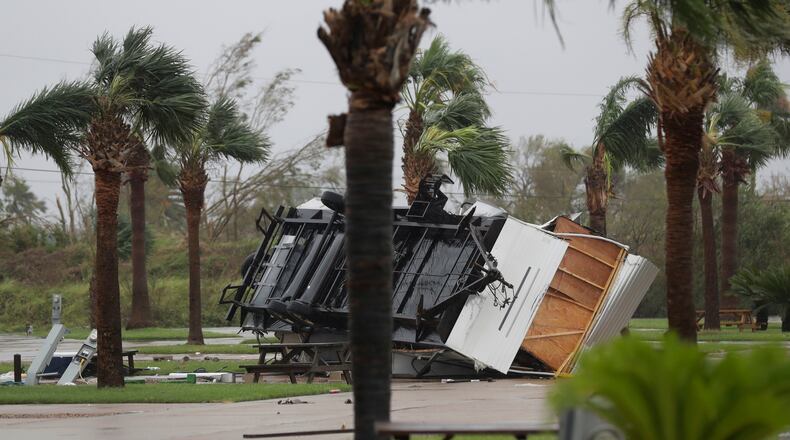 An overturned trailer sits in a park in the wake of Hurricane Harvey, Saturday, Aug. 26, 2017, in Aransas Pass, Texas. Harvey rolled over the Texas Gulf Coast on Saturday, smashing homes and businesses and lashing the shore with wind and rain so intense that drivers were forced off the road because they could not see in front of them. (AP Photo/Eric Gay)