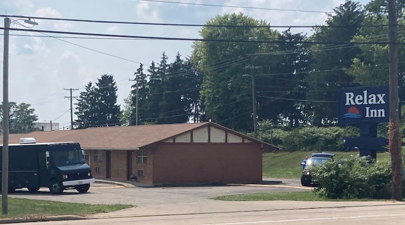 A Dayton man surrendered after an hourslong standoff Sunday, Aug. 8, 2021, at the Relax Inn on South Dixie Drive in Moraine after telling police he had "guns and bombs," according to a report. No weapons or devices were found and no one was hurt. KAITLIN SCHROEDER/STAFF