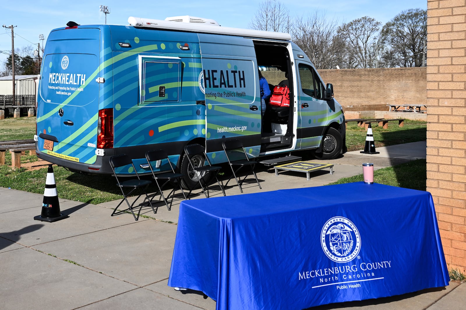A mobile health unit is parked outside of Independence High School in Charlotte, N.C., on Wednesday, March 19, 2025. (AP Photo/Matt Kelley)