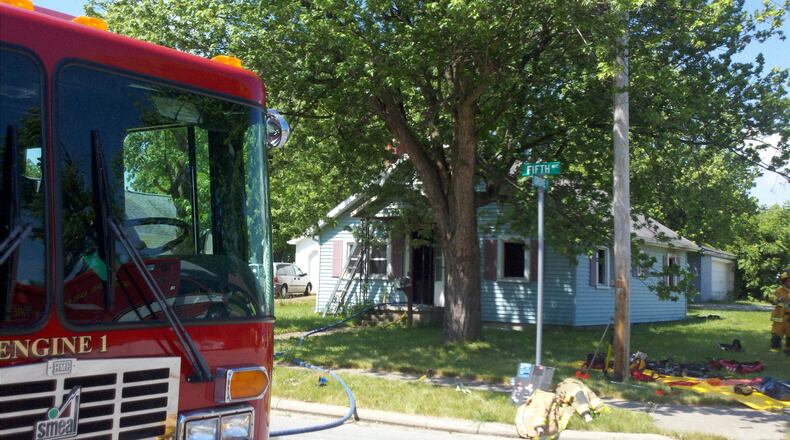 Firefighters rescued a teenager from a house fire Saturday morning in Sidney.