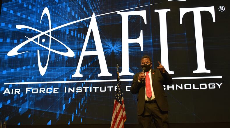 Dr. Adedeji Badiru, dean of the Air Force Institute of Technology’s Graduate School of Engineering and Management, presents the school’s annual awards honoring faculty and staff for outstanding performance on Jan. 22. U.S. AIR FORCE PHOTO/KATIE SCOTT