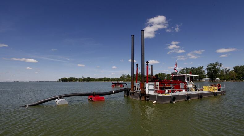 At Grand Lake St. Marys, the state’s largest inland lake, three dredges are helping to scoop 300,000 cubic yards of muck from the bottom of the lake this year. By year’s end more than 1 million cubic yards of phosphorous-laden sediment will have been removed from the lake since 2011. LISA POWELL / STAFF