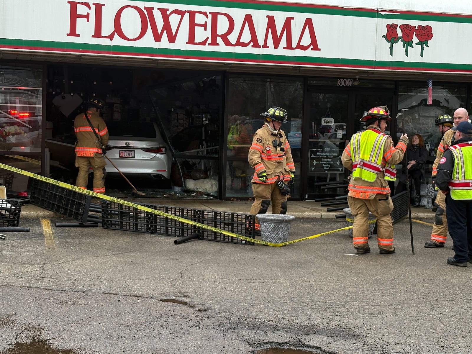Emergency crews work after a car crashed into Flowerama, 3000 Shroyer Road in Kettering on Thursday, March 5, 2026. JEN BALDUF / STAFF