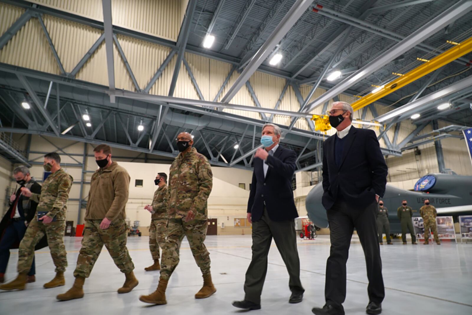 Col. Cameron Pringle, 319th Reconnaissance Wing commander, (third from left), Air Force Chief of Staff Gen. Charles Q. Brown Jr., Sen. John Hoeven and Sen. Kevin Cramer, depart an aircraft hangar at Grand Forks Air Force Base, North Dakota, Feb. 17. Brown received a brief from members of the 319th Aircraft Maintenance Squadron, who shared information regarding the critical role the RQ-4 Global Hawk plays in the Air Force’s intelligence, surveillance and reconnaissance mission. U.S. AIR FORCE PHOTO/STAFF SGT. ELORA J. MCCUTCHEON