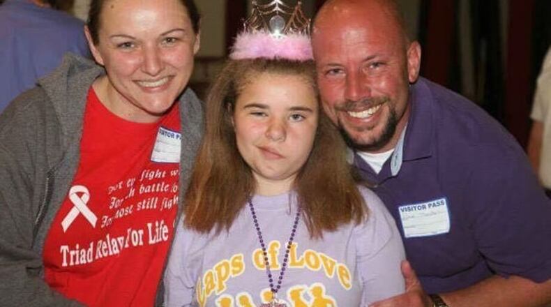 Bethany Thompson, middle, in a picture with her mother, Wendy Feucht and father, Paul Thompson.