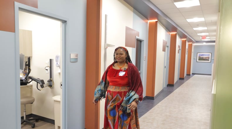 Dr. Rachelle Dulan Hood walks down the hall in the new Kettering Health Primary Care Doctors Office Thursday, Feb. 6, 2025 before the grand opening of Homefull’s Healthy Living in West Dayton project. BILL LACKEY/STAFF
