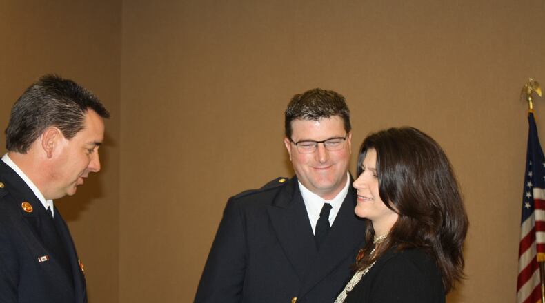 West Chester Twp. Fire Chief Rick Prinz presented his new assistant chief for operations Stephen Oughterson to the trustees for confirmation Feb. 28. Pictured are Prinz and Oughterson with his wife, Debra.