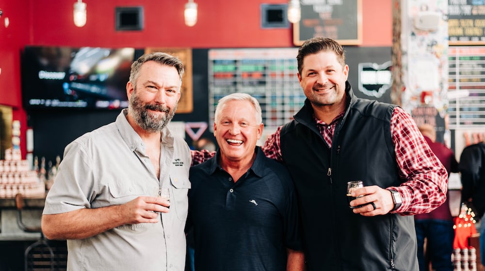 For more than 10 years, Warped Wing Brewing Co. has collaborated with Esther Price Candies on a seasonal beer. Pictured (left to right) is John Haggerty, owner of Warped Wing, Doug Dressman, CEO of Esther Price, and Nick Bowman, owner of Warped Wing (CONTRIBUTED PHOTO).
