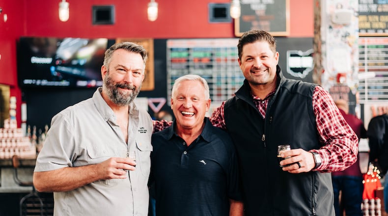 For more than 10 years, Warped Wing Brewing Co. has collaborated with Esther Price Candies on a seasonal beer. Pictured (left to right) is John Haggerty, owner of Warped Wing, Doug Dressman, CEO of Esther Price, and Nick Bowman, owner of Warped Wing (CONTRIBUTED PHOTO).