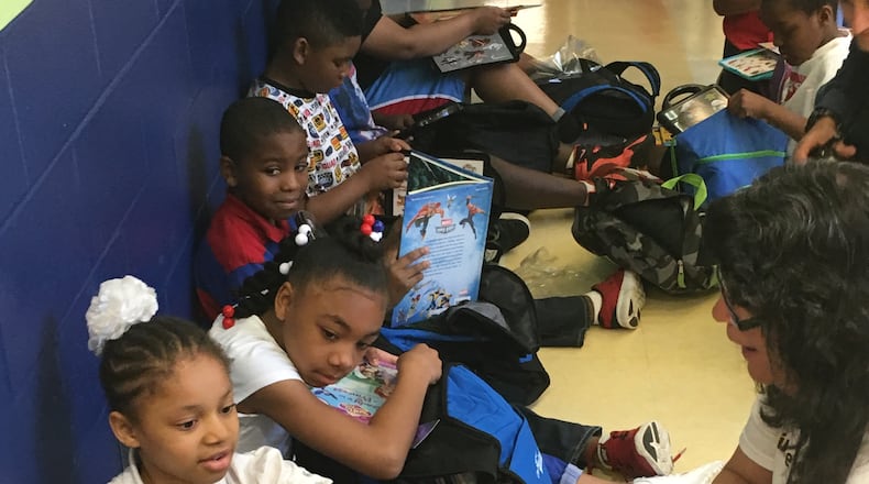 Students at Dayton’s Fairview Elementary get ready to take home books for the summer thanks to the Read On program in 2016. JEREMY P. KELLEY / STAFF