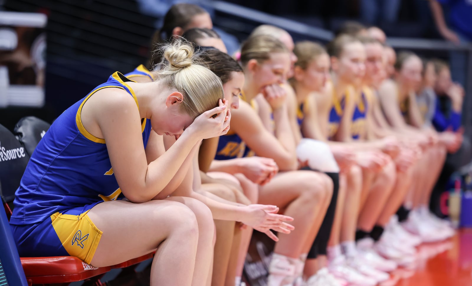 Russia players wait to receive individual medals on their bench following a 38-17 loss to Strasburg Franklin in the Division VII state final on Saturday, March 14 at University of Dayton Arena. BRYANT BILLING / STAFF