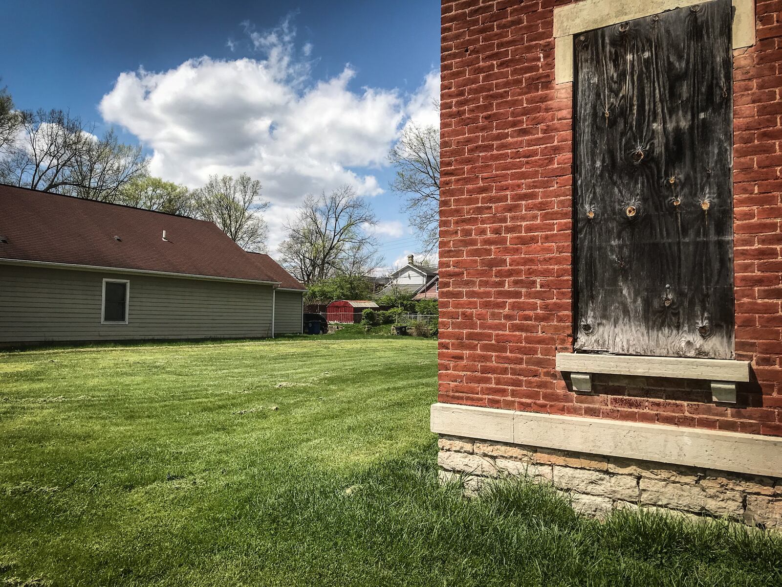 Lots where abandoned homes in Dayton’s Wolf Creek neighborhood once stood will be used for new single-family homes.