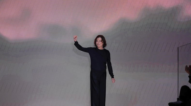 Silvana Armani is greeted by the public at the end of the Giorgio Armani Fall/Winter 2026-2027 Women's collection presented in Milan, Italy, Sunday, March 1, 2026. (AP Photo/Antonio Calanni)