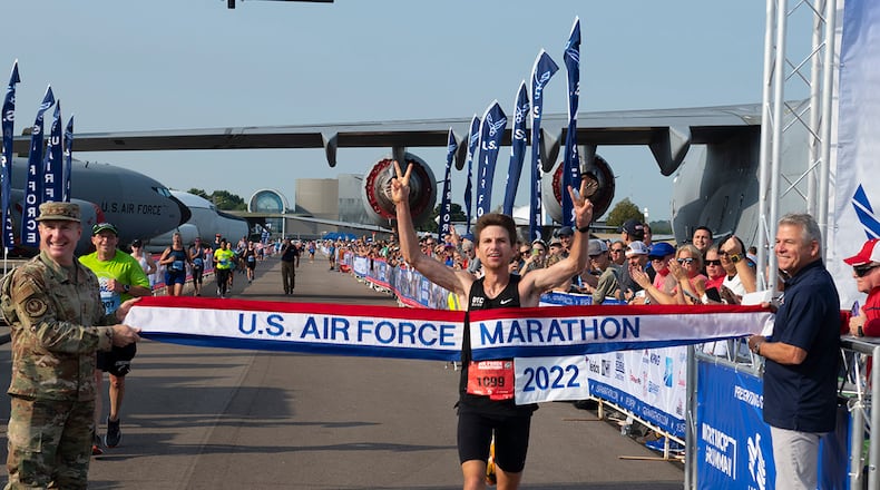 Jason Salyer of Tipp City, crosses the finish line as the winner of the USAF Marathon on Sept. 17, 2022. On Sunday, Salyer won the Flying Pig Marathon in Cincinnati. U.S. AIR FORCE PHOTO/R.J. ORIEZ