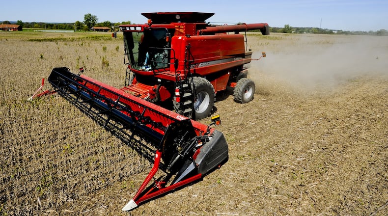 Bob Minges harvests a field of soy beans Monday, Sept. 24, 2012 in Morgan Twp. in Butler County. Minges, along with his brother Larry and sons, Greg and Brad, farms over 2000 acres of mostly corn and soybeans. “This is the worst year we have ever had,” said Minges. Staff photo by Nick Graham