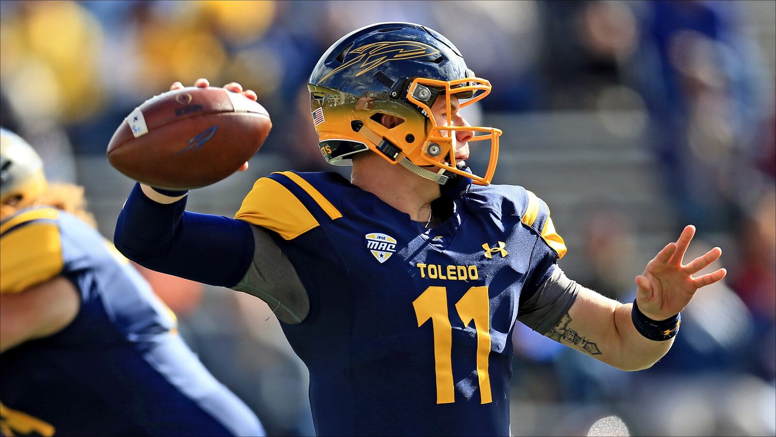 TOLEDO, OH - OCTOBER 22: Quarterback Logan Woodside #11 of the Toledo Rockets throws a pass against Central Michigan Chippewas at Glass Bowl on October 22, 2016 in Toledo, Ohio.  (Photo by Andrew Weber/Getty Images)