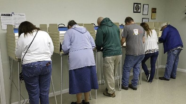 Miami County voters at the polls. BILL LACKEY/STAFF