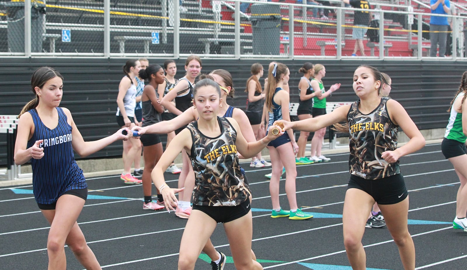 Runners in the 4x800 relay at the 2025 GWOC track meet at Heidkamp Stadium in Huber Heights on May 14.