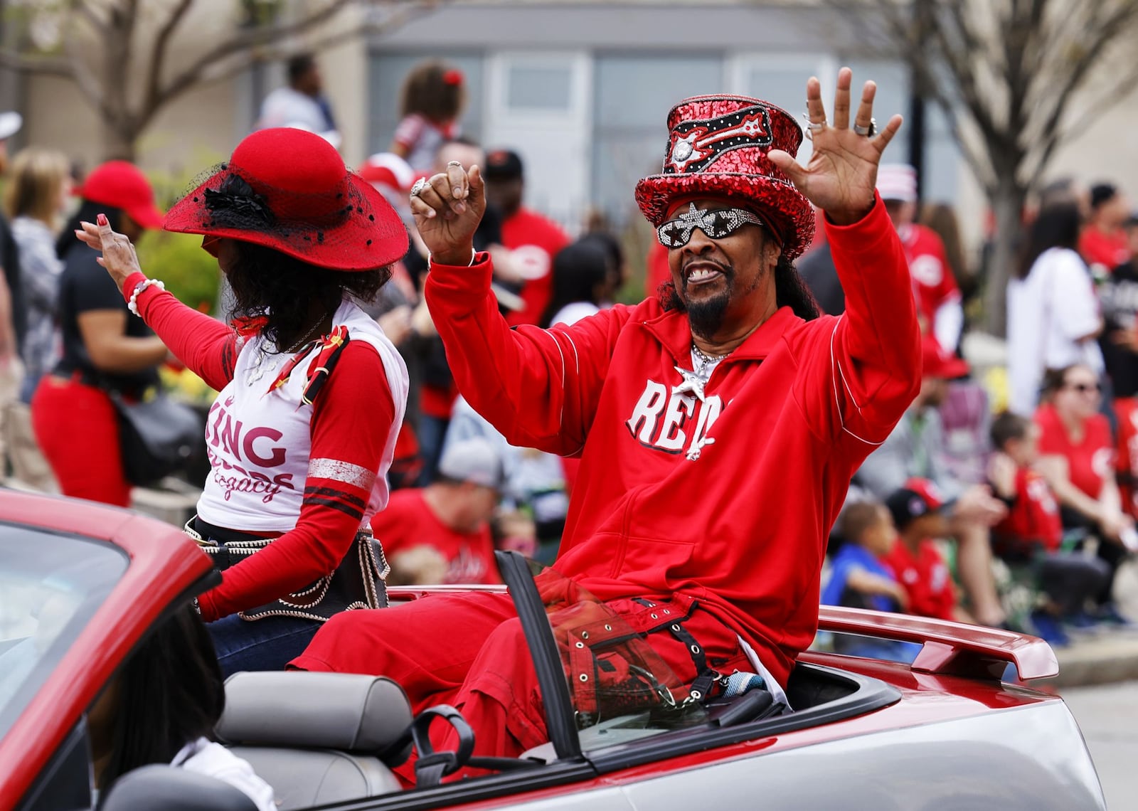 Funk legend Bootsy Collins waves at the crowd gathered for the Findlay Market Opening Day Parade Tuesday, April 12, 2022 in downtown Cincinnati before the Reds played their first home game of the season. NICK GRAHAM/STAFF