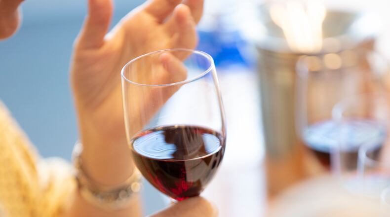 FILE -- Tasting a red wine in New York on Sept. 26, 2019. Moderate drinking is unlikely to impair the immune response to the COVID-19 vaccine, but heavy drinking might. (Tony Cenicola/The New York Times)
