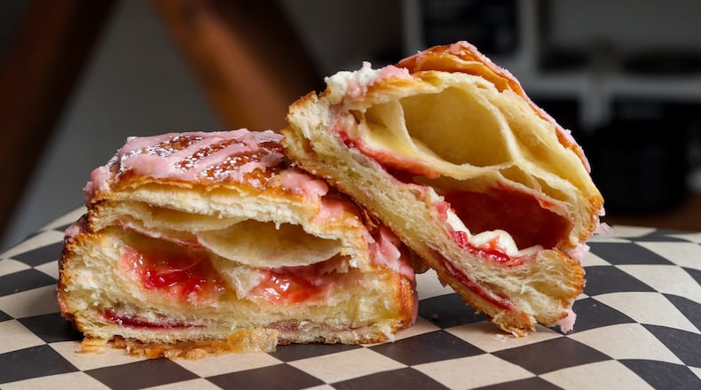 Pictured is the Strawberry Mascarpone’s Pain au Chocolat (strawberry white chocolate and mascarpone cream in a croissant with strawberry glaze and powdered sugar) at Val's Bakery in Dayton (CONTRIBUTED PHOTO).