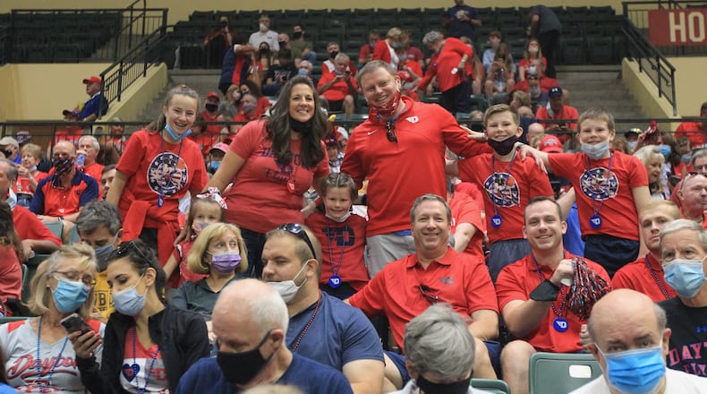 Dave and Moreeen Nienaber and their kids pose for a photo before Dayton's game against Miami at the ESPN Events Invitational at HP Fieldhouse on Thursday, Nov. 25, 2021, in Kissimmee, Fla. David Jablonski/Staff