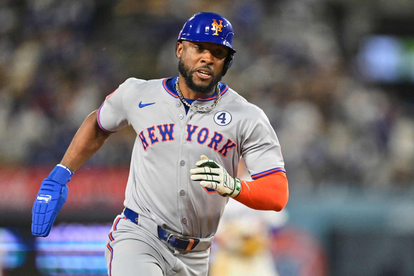 New York Mets' Starling Marte scores on a single by Mets' Francisco Lindor in the tenth inning of a baseball game against the Los Angeles Dodgers, Monday, June 2, 2025, in Los Angeles. (AP Photo/Jayne Kamin-Oncea)