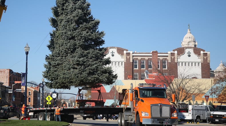 The Christmas tree for Troy's Public Square was delivered Thursday, Nov. 12. The city's Holiday Lighting 2020 event kicks off at 6:30 p.m. Friday, Nov. 27. There will be Christmas music, the arrival of Santa on a fire truck and the annual lighting of the tree and levee lights. Facial coverings and social distancing are encouraged and commemorative masks will be available. LISA POWELL / STAFF