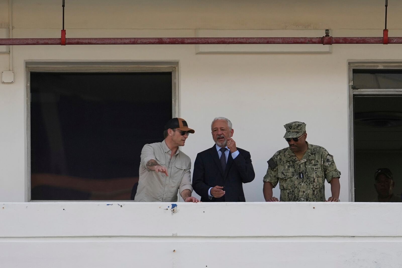 U.S. Defense Secretary Pete Hegseth, left, chats with Panama Canal Authority Administrator Ricaurte Vasquez, center, and Southcom Commander Navy Adm. Alvin Holsey during a tour of the Panama Canal's Miraflores Locks in Panama City, Tuesday, April 8, 2025. (AP Photo/Matias Delacroix)