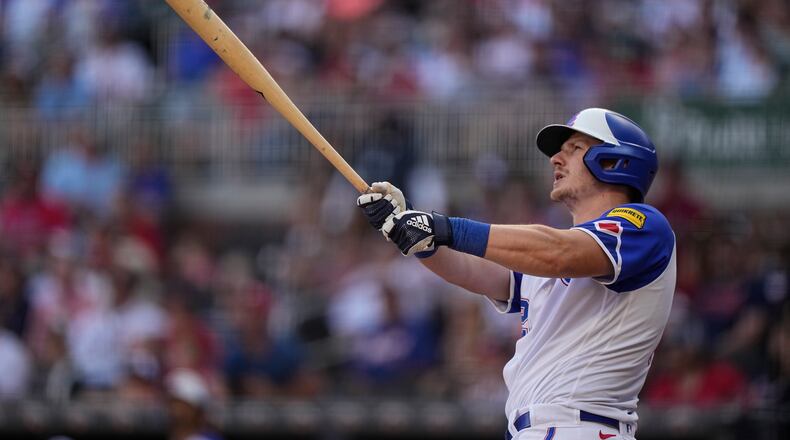 Atlanta Braves' Sean Murphy (12) hits a solo home run in the ninth inning of a baseball game against the Philadelphia Phillies, Saturday, May 27, 2023, in Atlanta. (AP Photo/Brynn Anderson)