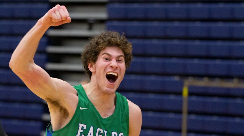 Chaminade Julienne senior Daniel Nauseef celebrates toward the student section as he leaves the floor after the Eagles defeated Alter 69-60 in the Division II district semifinals Friday at Fairmont High School's Trent Arena. Jeff Gilbert/CONTRIBUTED