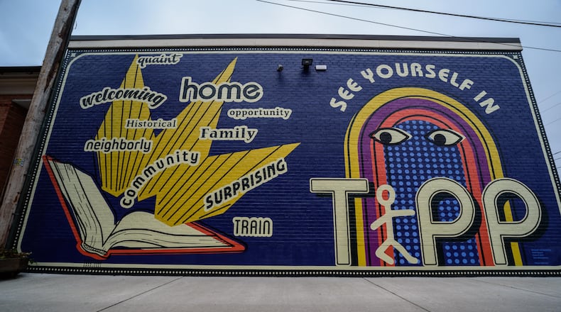 The new "See Yourself in Tipp" mural on the wall of the Tipp City Public Library facing the Coldwater Cafe at their shared alley outdoor patio space on January 4, 2021. TOM GILLIAM