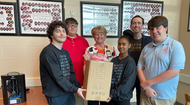 Dayton Public School students with Greg Loughnane, a University of Dayton professor in the Department of
Mechanical and Aerospace Engineering, who is leading the Digital
Manufacturing Workshop.