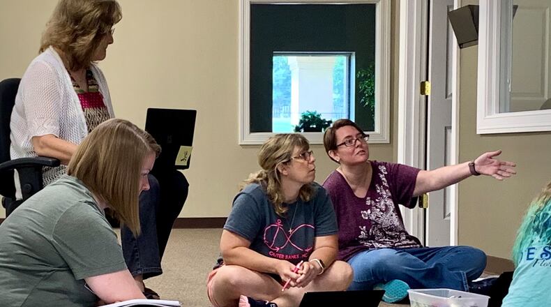 Teachers at the Community Steam School- Xenia brainstorm lesson plans for the year ahead of the school’s inaugural class. LONDON BISHOP/STAFF