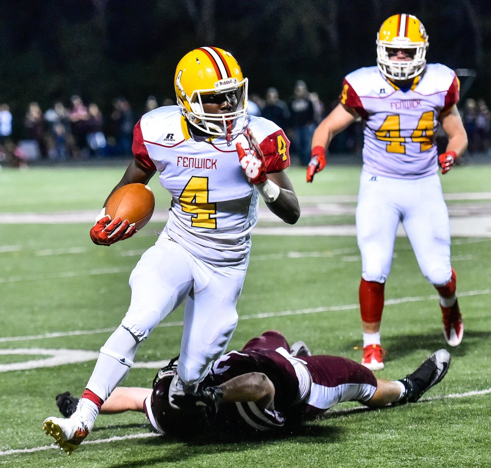 Fenwick’s Caleb Davis carries the ball during a game against Lebanon on Sept. 8, 2017, at Jim VanDeGrift Stadium in Lebanon. The host Warriors triumphed 49-27. NICK GRAHAM/STAFF