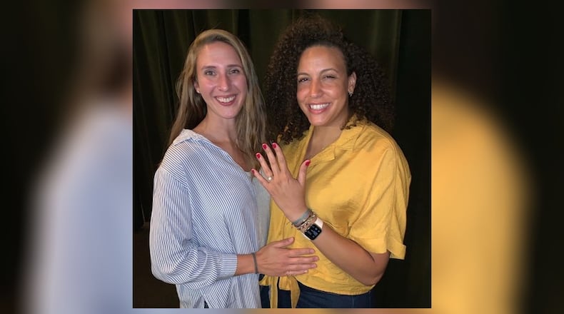 Casey Nance shows off her engagement ring. She and Cassie Sant, former Dayton Flyers teammates, plan to wed next May 21. CONTRIBUTED