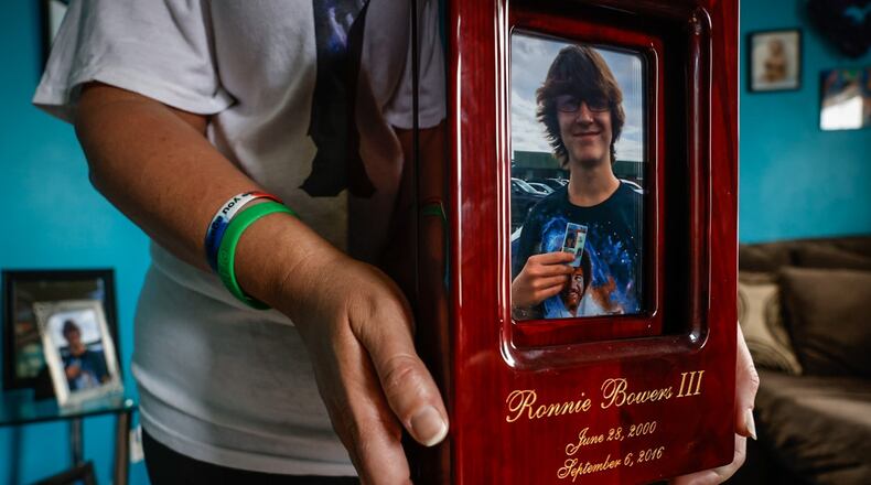 Jessica Combs keeps Ronnie Bowers ashes on a kitchen shelf. Combs started a scholarship in honor of her son who was shot in 2016 while fleeing a confrontation in which he was not involved. JIM NOELKER/STAFF