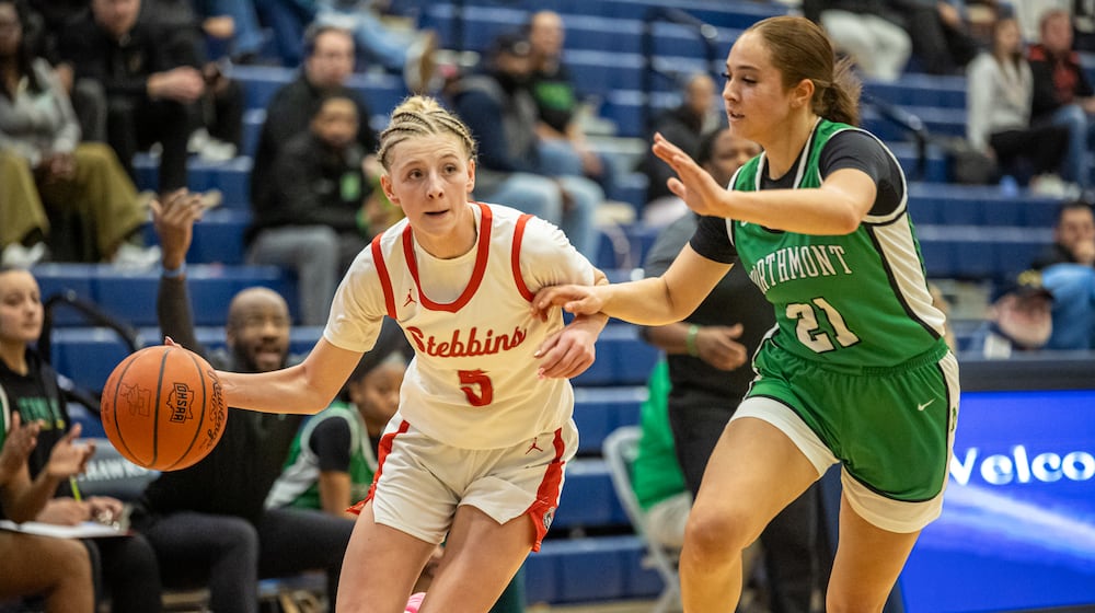 Stebbins High School senior Miley Amann drives past Northmont senior Jenna Hall during their Division II district semifinal game on Wednesday, Feb. 25, 2026 at Fairborn's Skyhawk Arena. The Vikings won 37-27. MICHAEL COOPER / STAFF