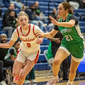 Stebbins High School senior Miley Amann drives past Northmont senior Jenna Hall during their Division II district semifinal game on Wednesday, Feb. 25, 2026 at Fairborn's Skyhawk Arena. The Vikings won 37-27. MICHAEL COOPER / STAFF