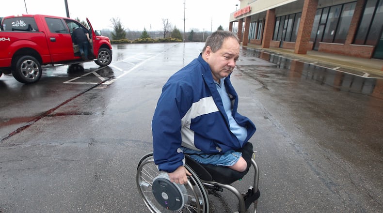 A proposed state law that would require drivers to move over for garbage trucks may prevent devastating injuries to workers like Kenny Lawson of Germantown who lost both his legs in a 1996 crash. CHRIS STEWART / STAFF