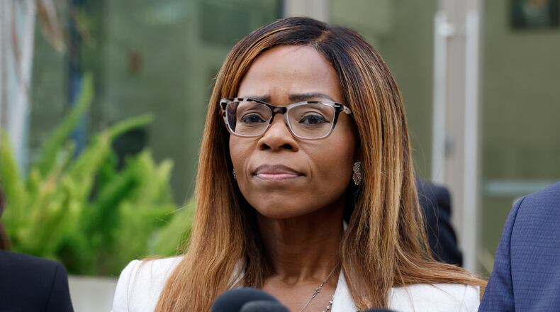 CORRECTS TO HEARING, NOT ARRAIGNMENT - U.S. Rep. Sheila Cherfilus-McCormick, D-Fla., speaks to the media after a hearing in federal court Monday, Dec. 29, 2025 in Miami. (AP Photo/Terry Renna)