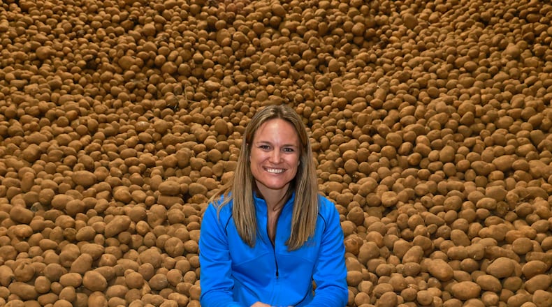Fourth-generation potato farmer Kathy Sponheim has a lot of spuds at Michael Family Farms in Champaign County. Kathy's family supplies potatoes across the Great Lakes region. BILL LACKEY/STAFF