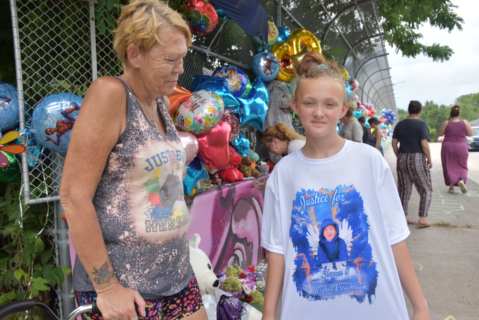 Missy Creachbaum and Lavaeh Benner on Tuesday, July 15, 2025 visited a memorial on a bridge on McClure Street for Hershall Creachbaum Jr. Missy is Hershall's grandmother and Lavaeh is his cousin. CORNELIUS FROLIK / STAFF