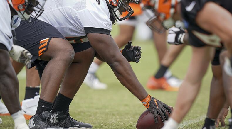 Cincinnati Bengals center Trey Hopkins (66) lines up for a play during NFL football training camp, Monday, July 29, 2019, in Cincinnati. (AP Photo/Bryan Woolston)